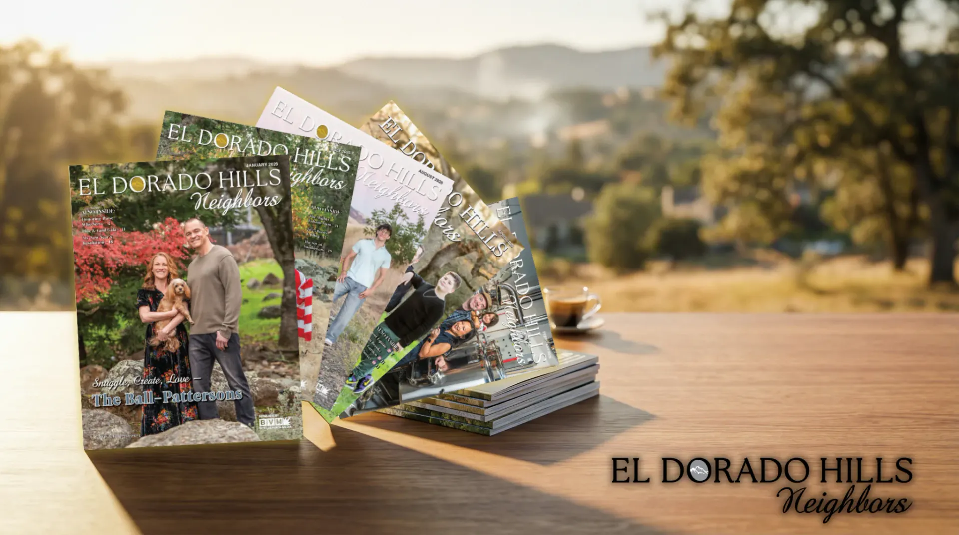 El Dorado Hills Neighbors issues fanned on a table above the foothills at golden hour